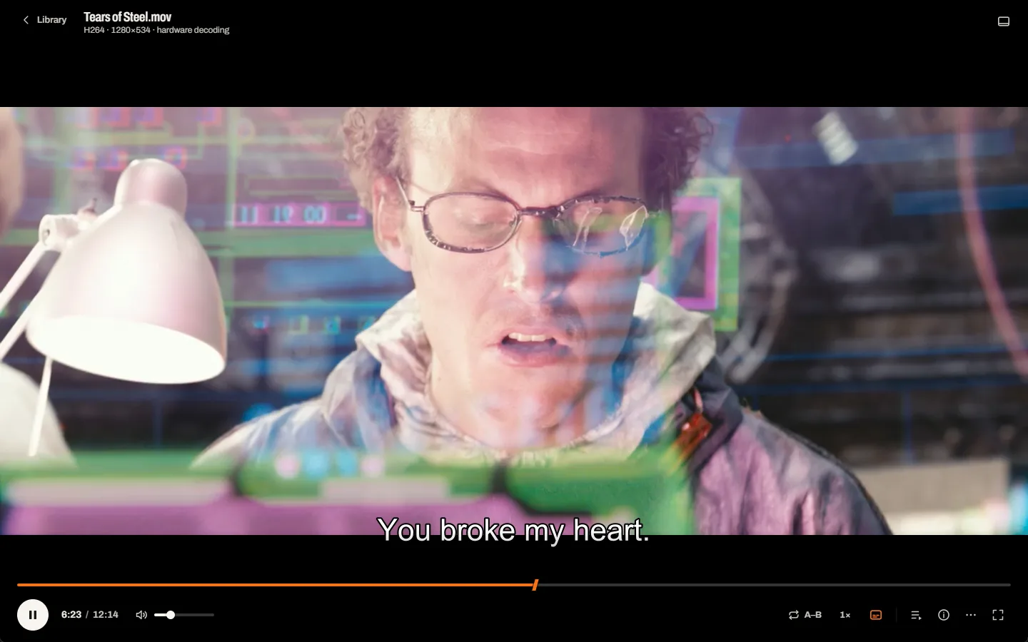 The player mid-film: a close-up scene from Tears of Steel, subtitles above a slim control deck.